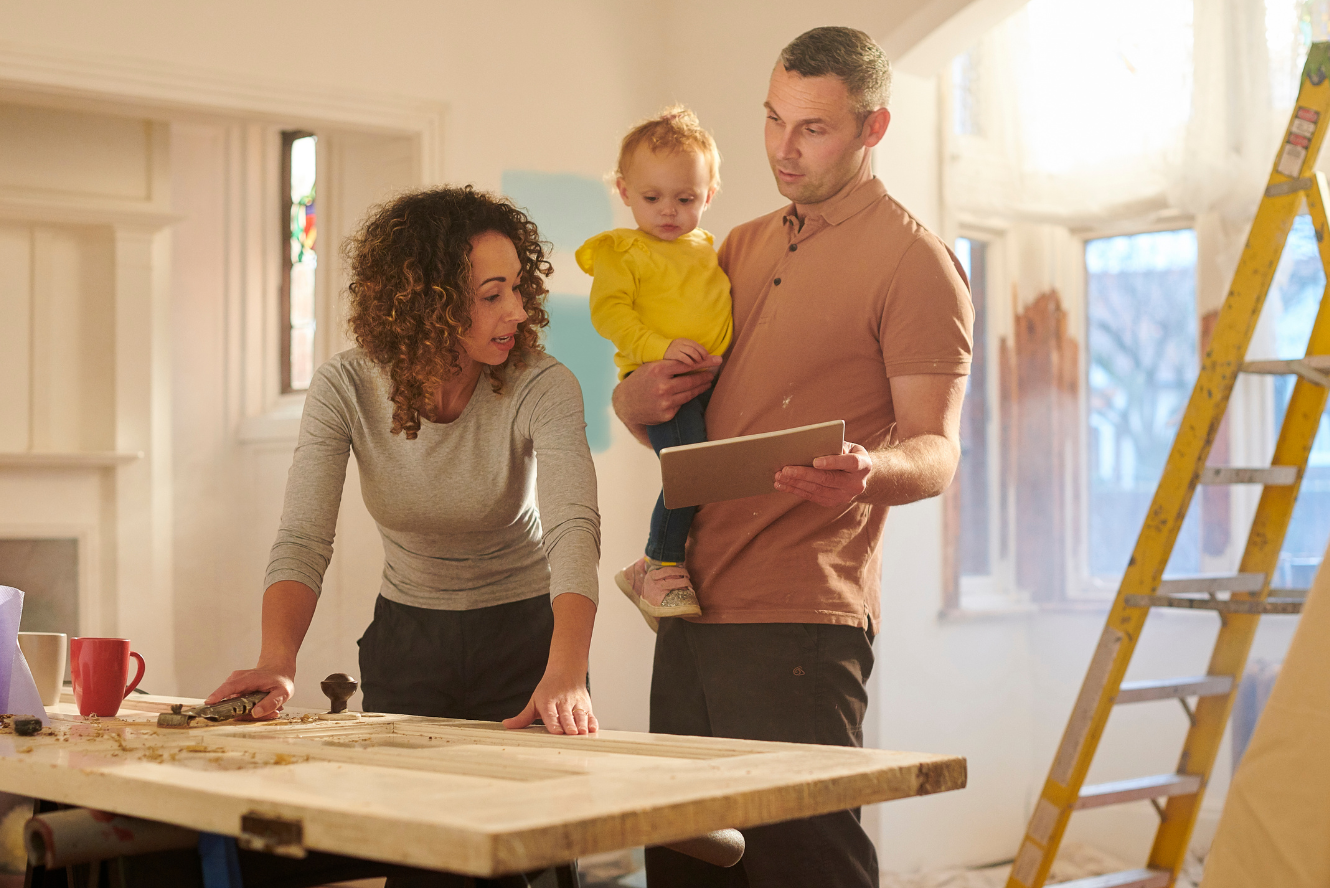 A family reviewing plans in their home. 
