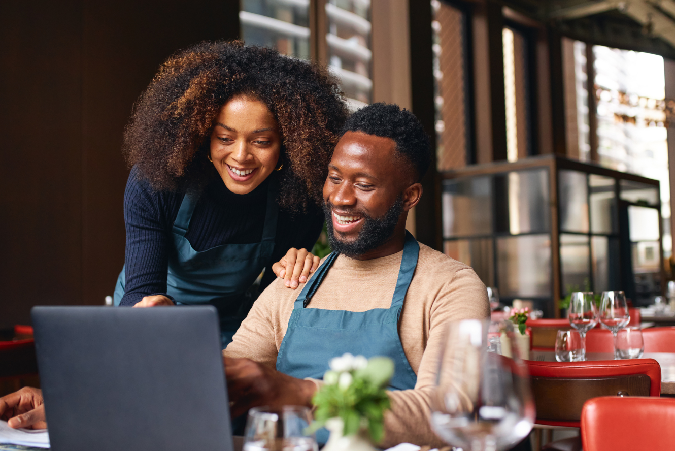 Two Business Owners reviewing information. 